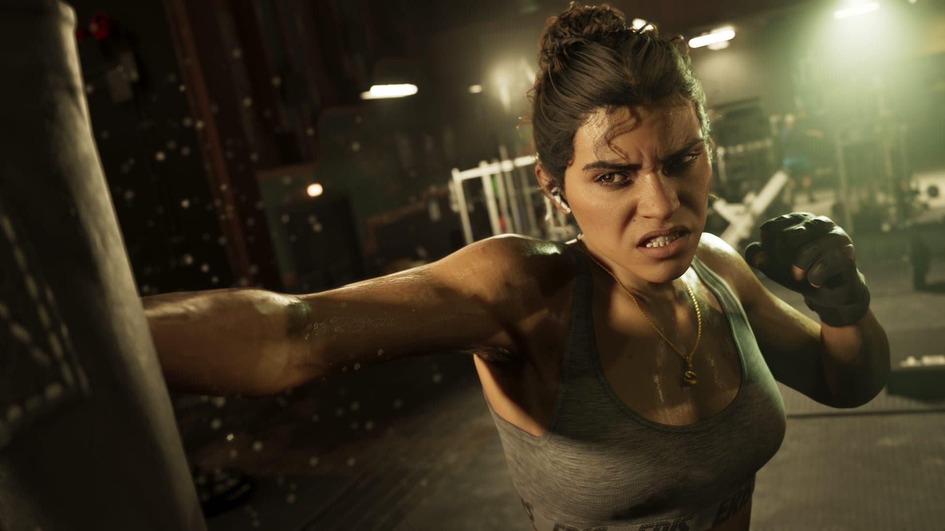 Lucia Caminos throwing a punch at a heavy bag in a dimly lit gym.